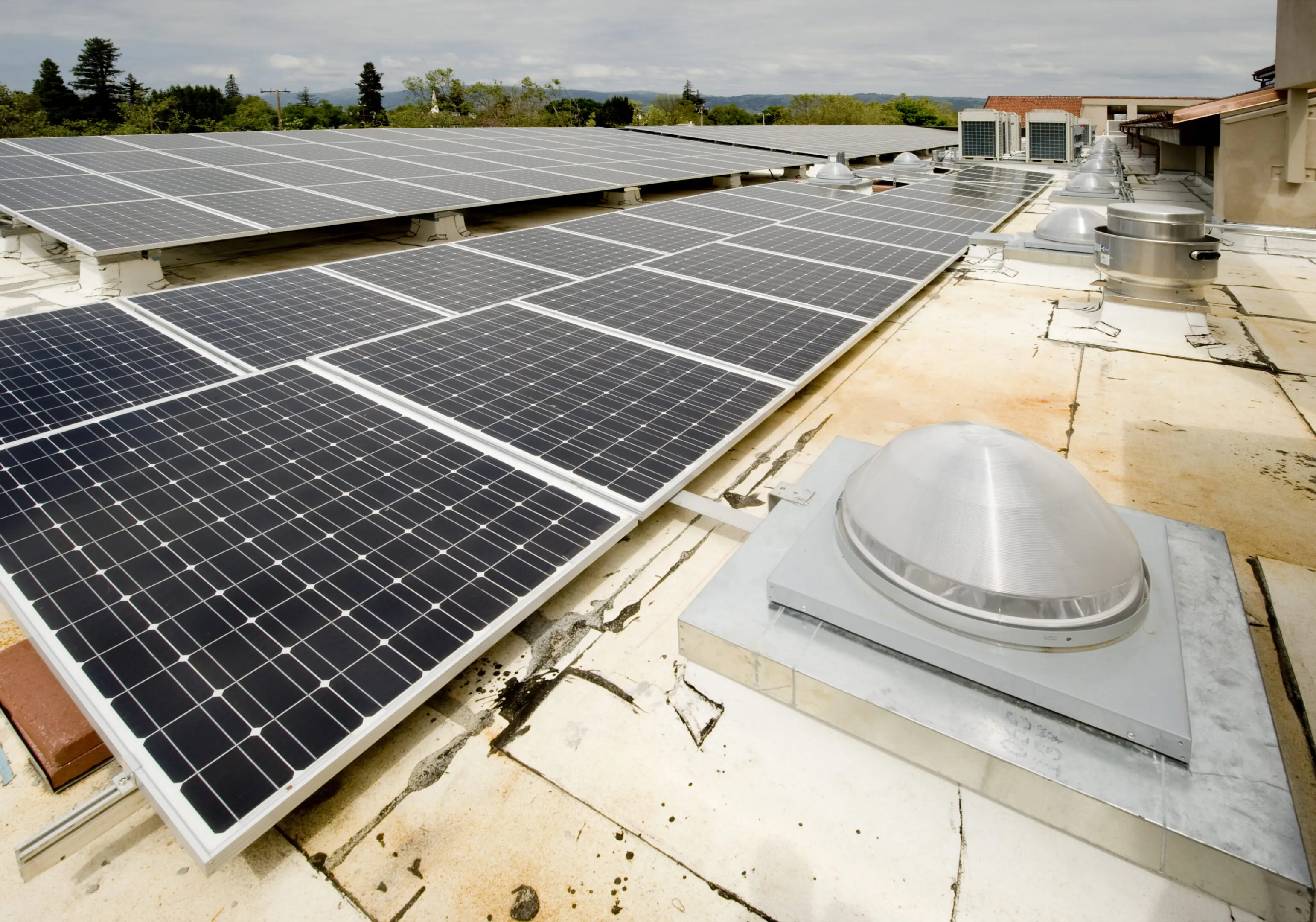 Solar panel installation on a membrane roof with additional variable refrigerant volume HVAC system.Click on any of the thumbnails below to see more HVAC Installations: