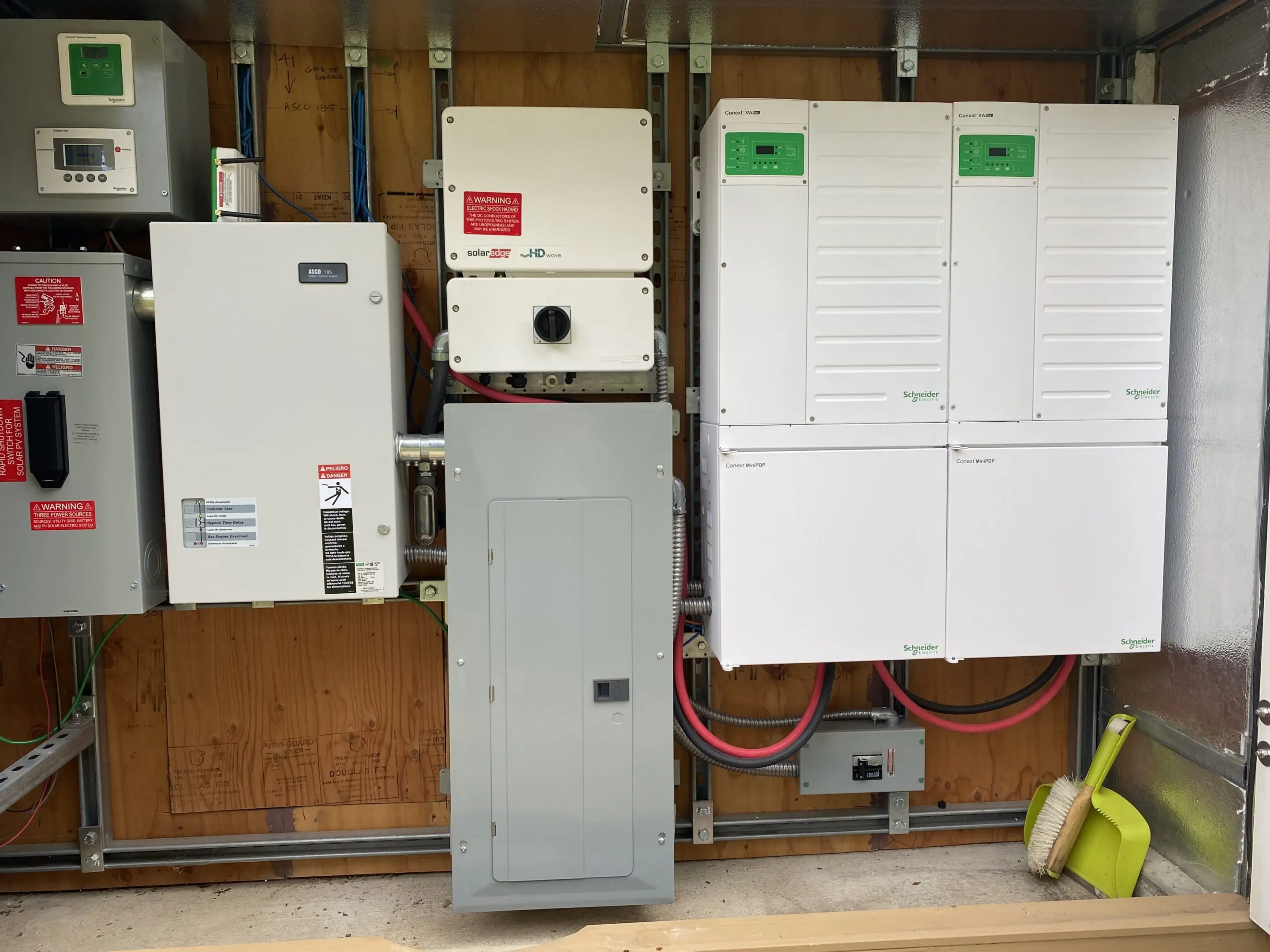 Energy storage system and inverters installed in a cabinet