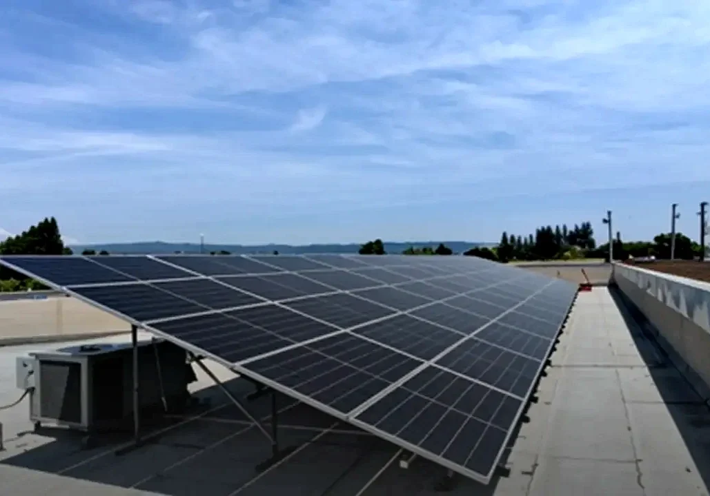 Rooftop solar array above an air conditioned retail building