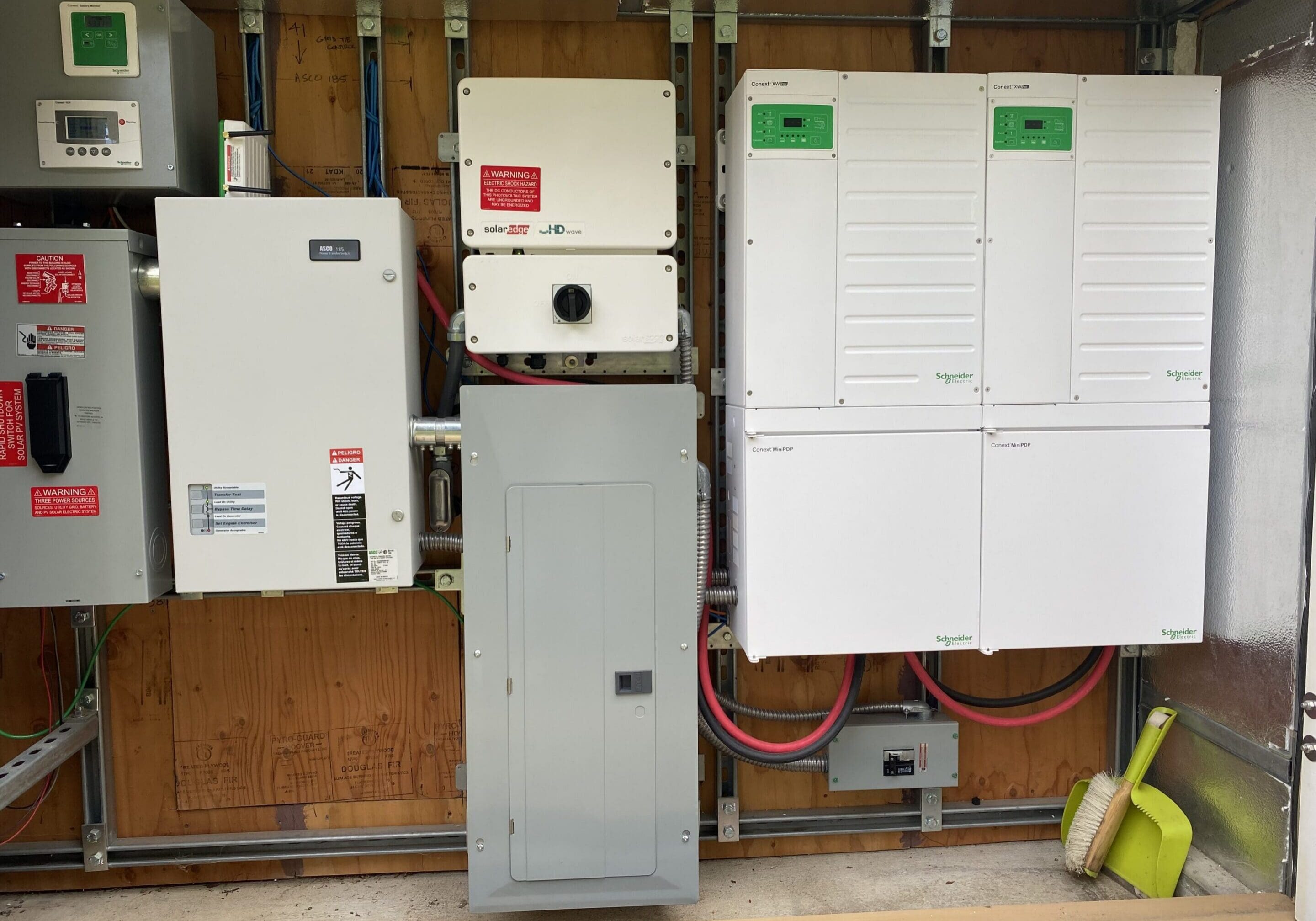 Energy storage system and inverters installed in a cabinet