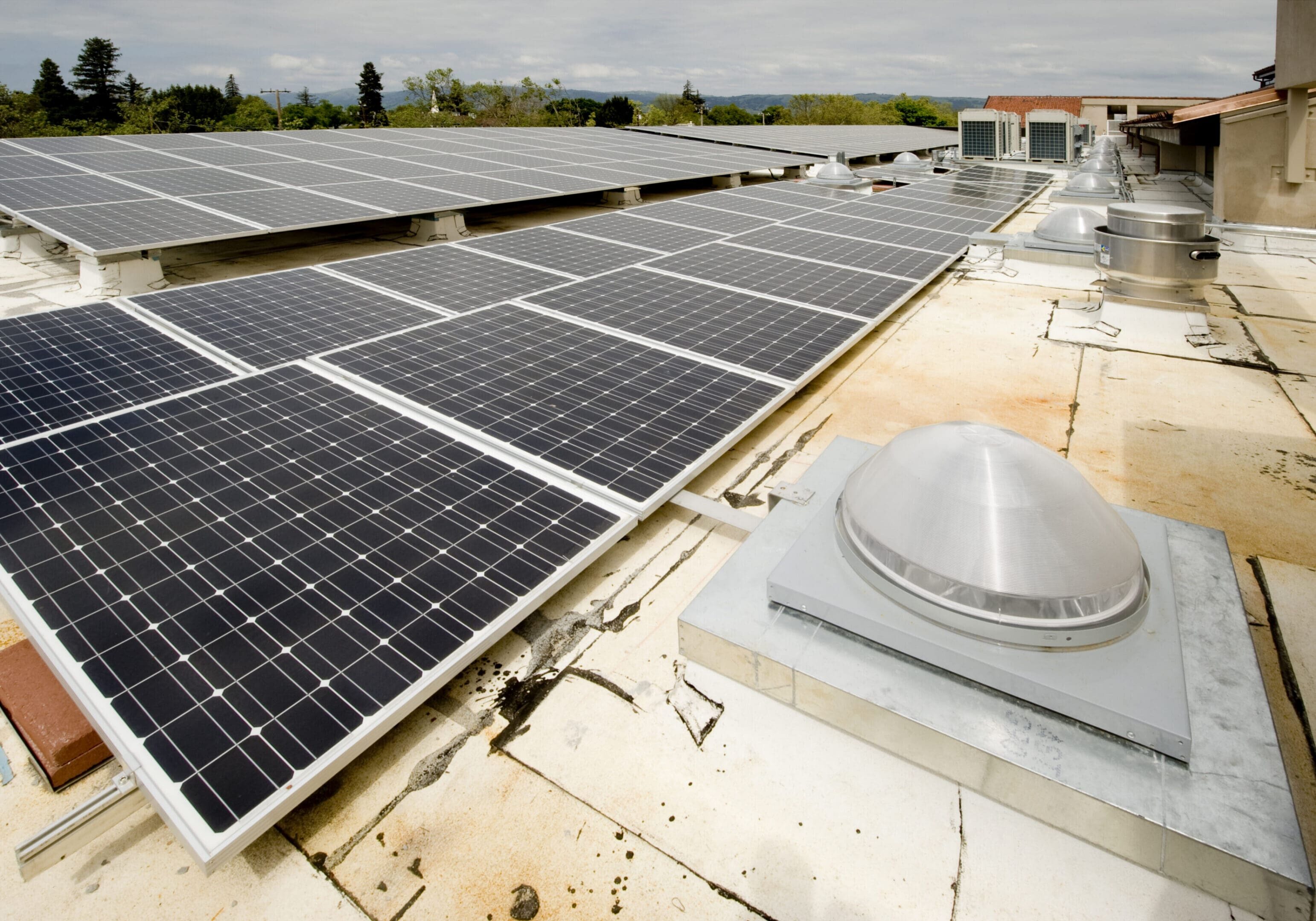 Solar panel installation on a membrane roof with additional variable refrigerant volume HVAC system.Click on any of the thumbnails below to see more HVAC Installations: