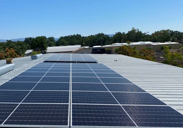 Warehouse rooftop solar array installed by Light Ray Electric